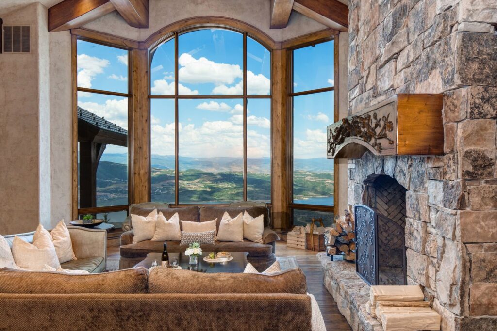 Beautiful mountain views featured from large living room with a fireplace at abode park city vacation rentals