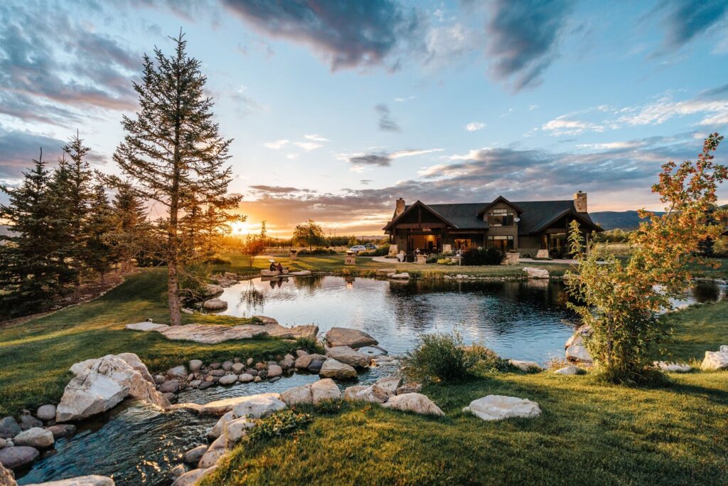 A sunset overlooking a waterfront cabin at the abode park city vacation rentals.